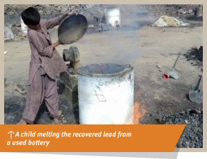 a child melting recovered lead from a used battery